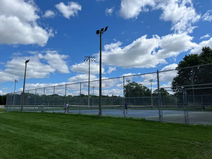Ground-level view of Riverside Park - Tennis Courts (1-2)